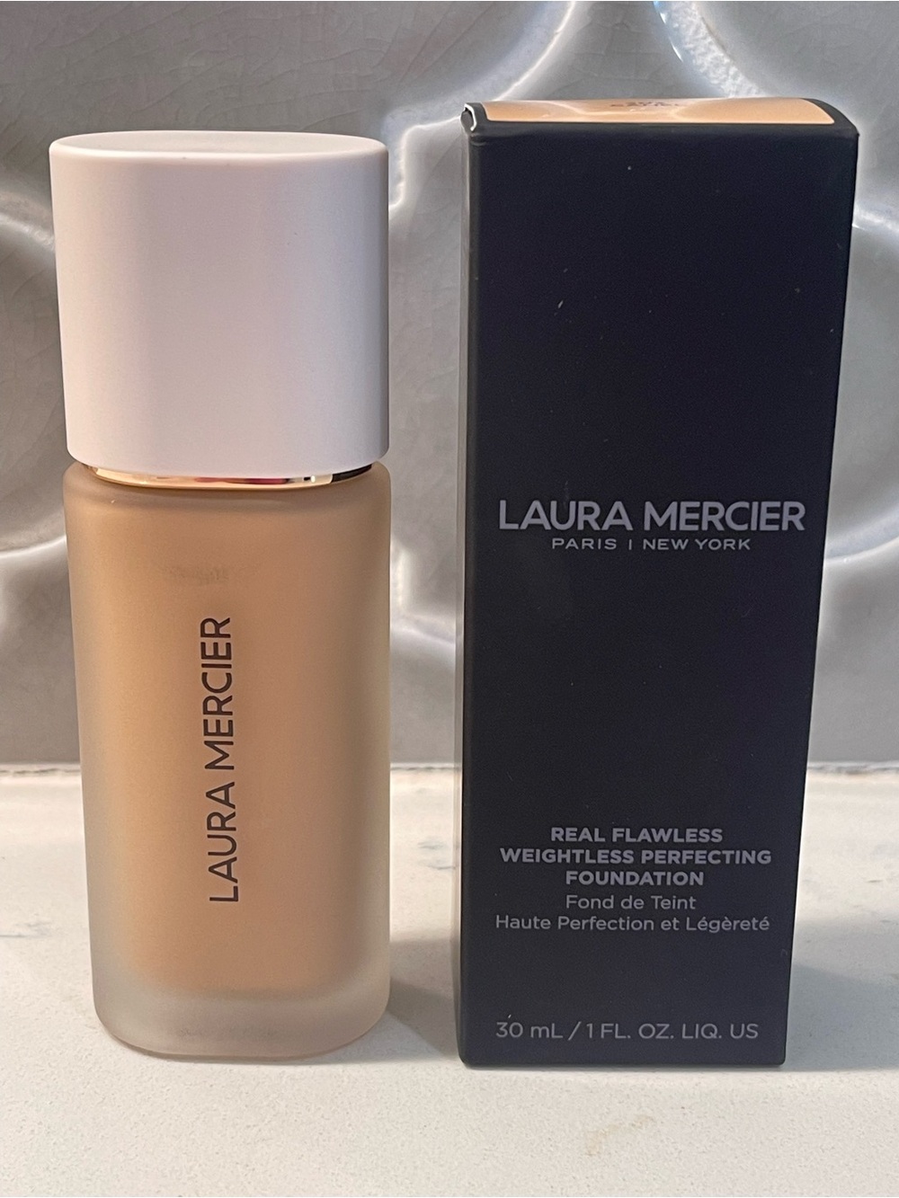 laura mercier Liquid Foundation Bottle in Beige with White Cap